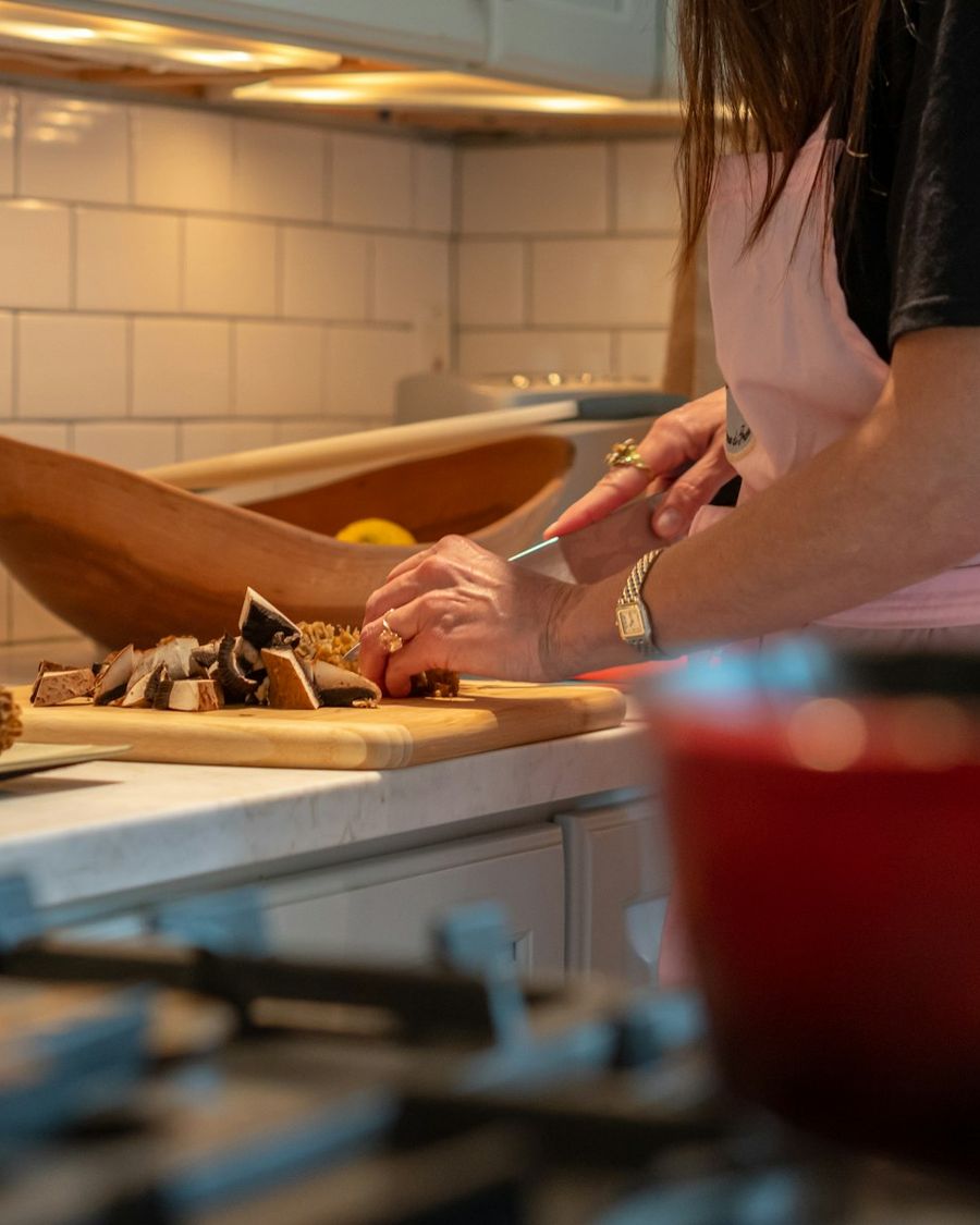 Hands preparing fresh vegetables on a kitchen worktop