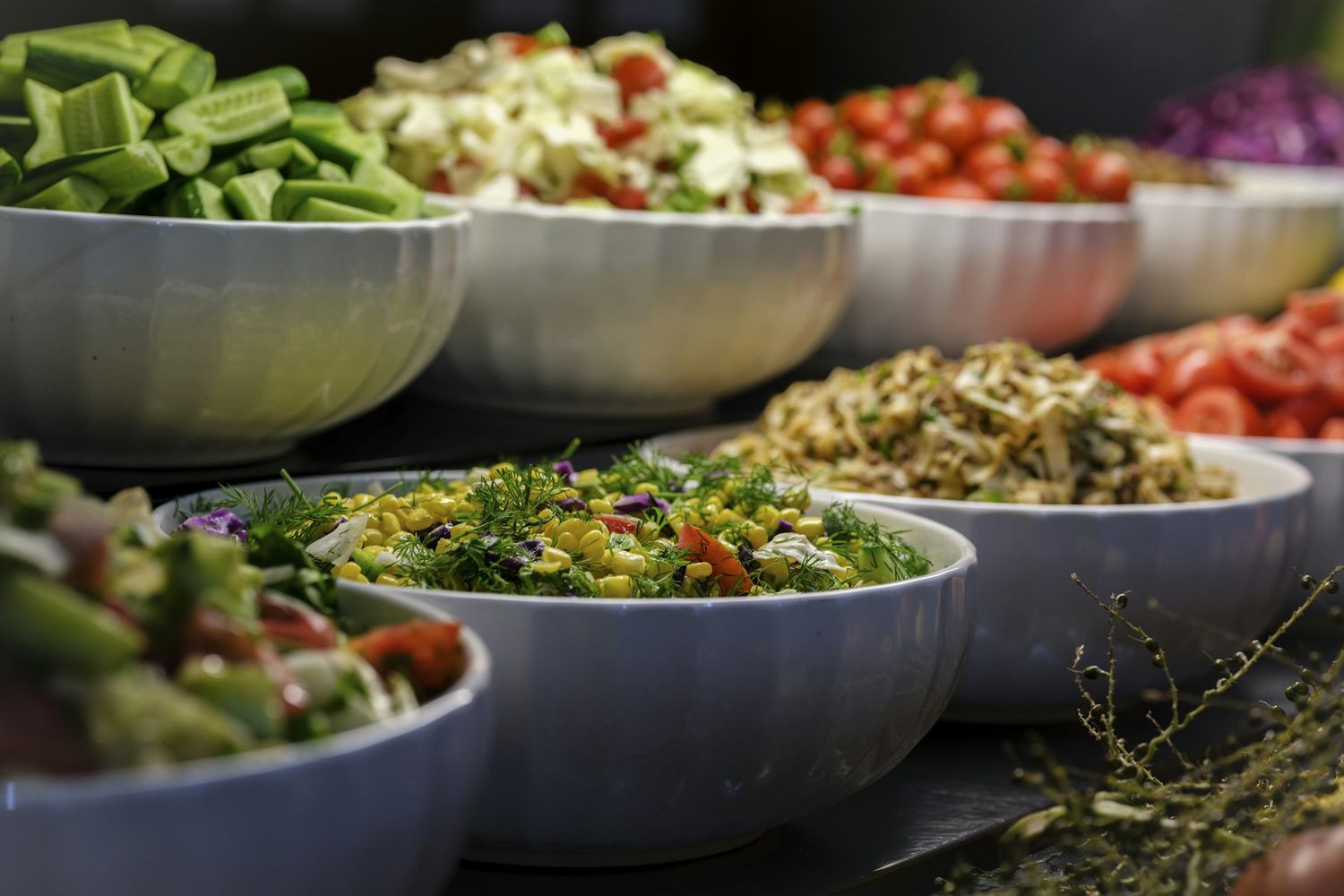 Bowls of fresh salads laid out for a lunch